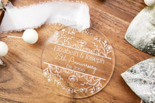 Load image into Gallery viewer, Clear Acrylic Personalized 25th anniversary ornament with engraved Names and wedding year on a wooden surface with decorative elements.