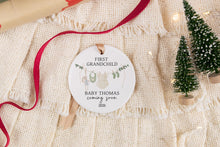 Load image into Gallery viewer, Personalized ceramic ornament for first girl grandchild. Personalized with the baby's last name and due year with decorative elements.