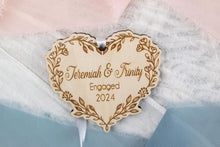 Load image into Gallery viewer, Personalized Engaged Christmas Ornament, Custom Engagement Gift for Couple, Wood Floral Vine Heart Ornament