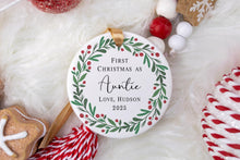 Load image into Gallery viewer, Personalized Christmas ornament with 'First Christmas as Auntie' text, surrounded by festive decorations on a white background.