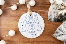 Load image into Gallery viewer, Personalized ornament with 'Married' text on a wooden surface with decorative elements.
