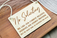 Load image into Gallery viewer, Angled view of a rectangular engraved wooden No Soliciting sign with white cotton rope hanger.