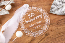 Load image into Gallery viewer, Personalized 10th anniversary ornament with decorative elements on a wooden surface
