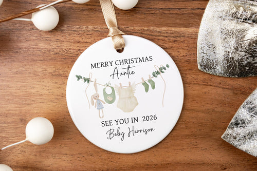 Round Merry Christmas Auntie ornament with personalization on a wooden surface with decorative elements.